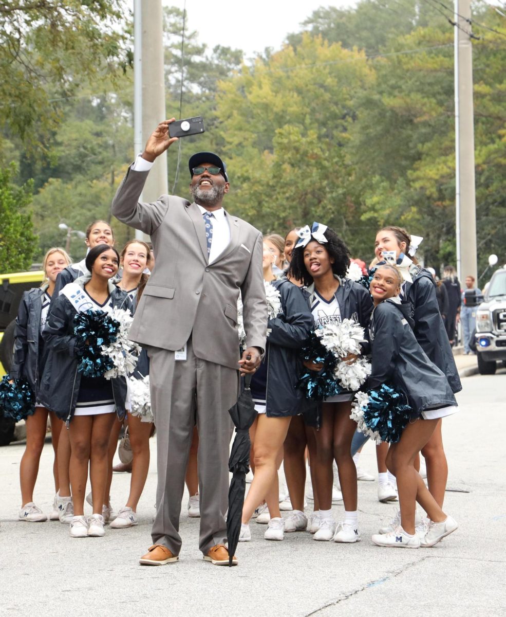 Dr. Crumbs capturing a moment with cheerleaders in the homecoming parade.
“I like interacting with the students...the most joyful part of this job is interacting
with them.” 