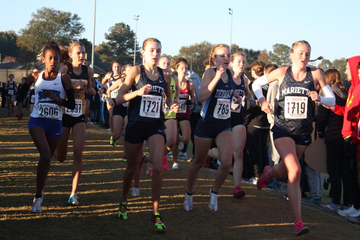 Mary Nesmith and Maddie Jones lead the front pack of girls on the state course with Nora Hart just steps behind. Sophomore, Nesmith, claimed the individual victory of 7A state champ with the team’s 4-peat.