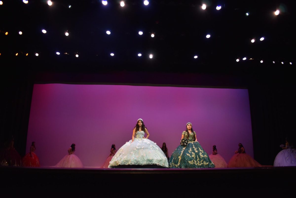 Aurelia Carbajal (left) and Astrid Roads (right) showcase thier Quinceañera
dresses in a parade of celebration.