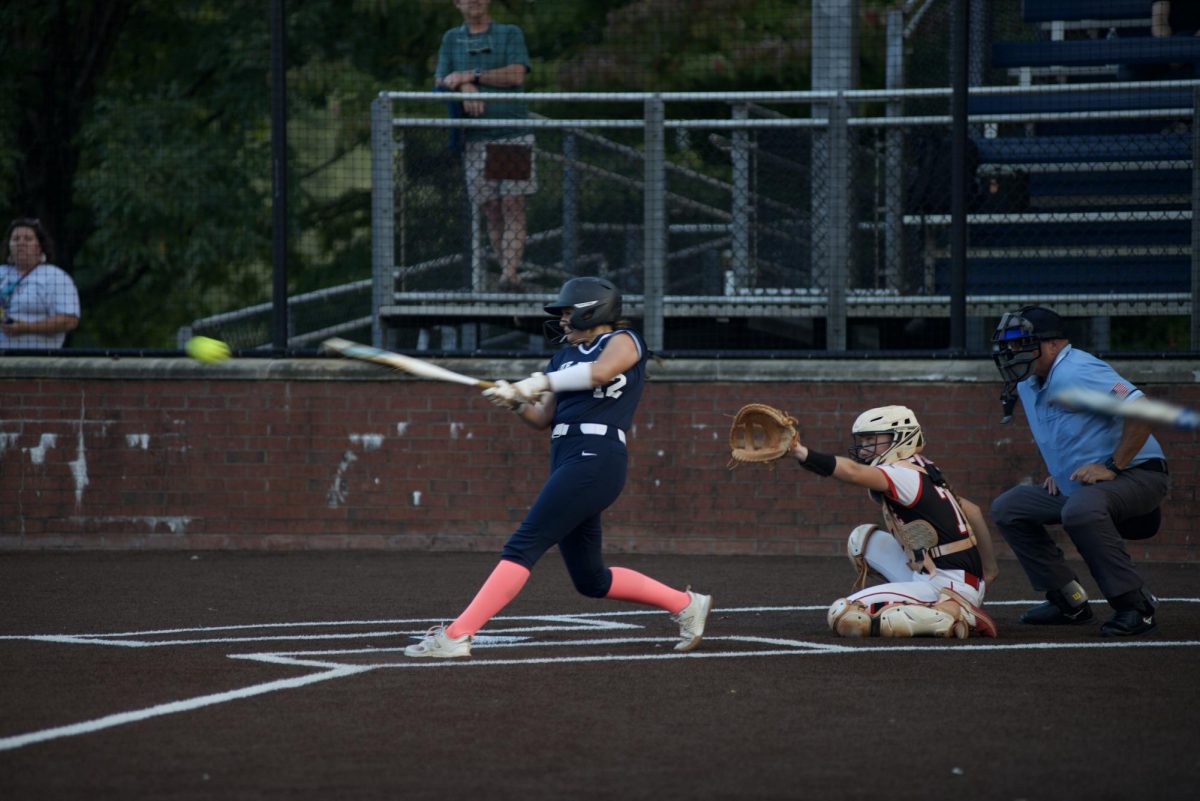 Sadie Mamer hits a double in a game versus Cherokee High. Photo by Gunnar Martin.