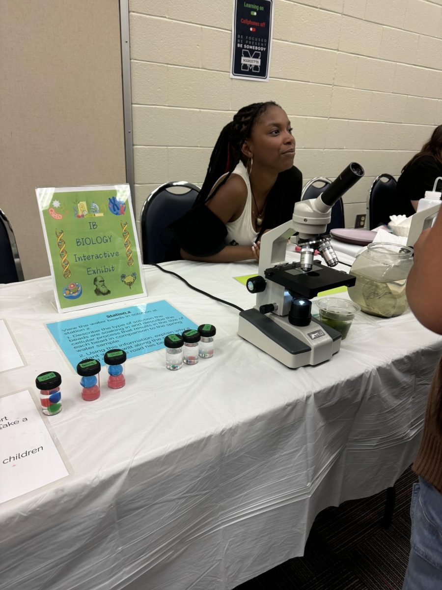 The IB Biology table showcased animal and water cells and students were able to look through a microscope.