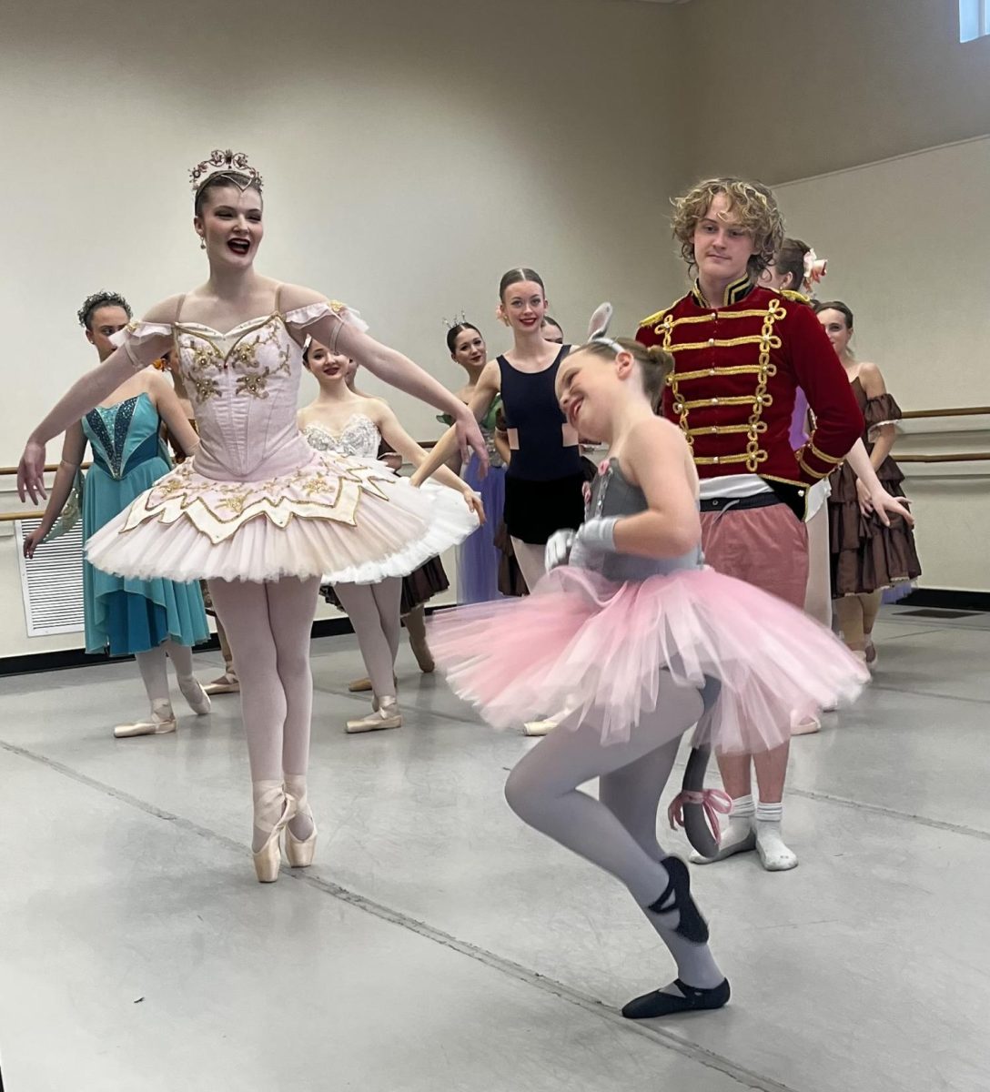 Sugar Plum Fairy, Amelia Jenkins, watches Ansleigh Hunt dance as Souris tells the story of how the Nutcracker and Clara made it to the land of sweets. After three months of practice, dancers begin practicing in full or partial costume two weeks before the performance for their In-Studio Dress Rehearsal. 


