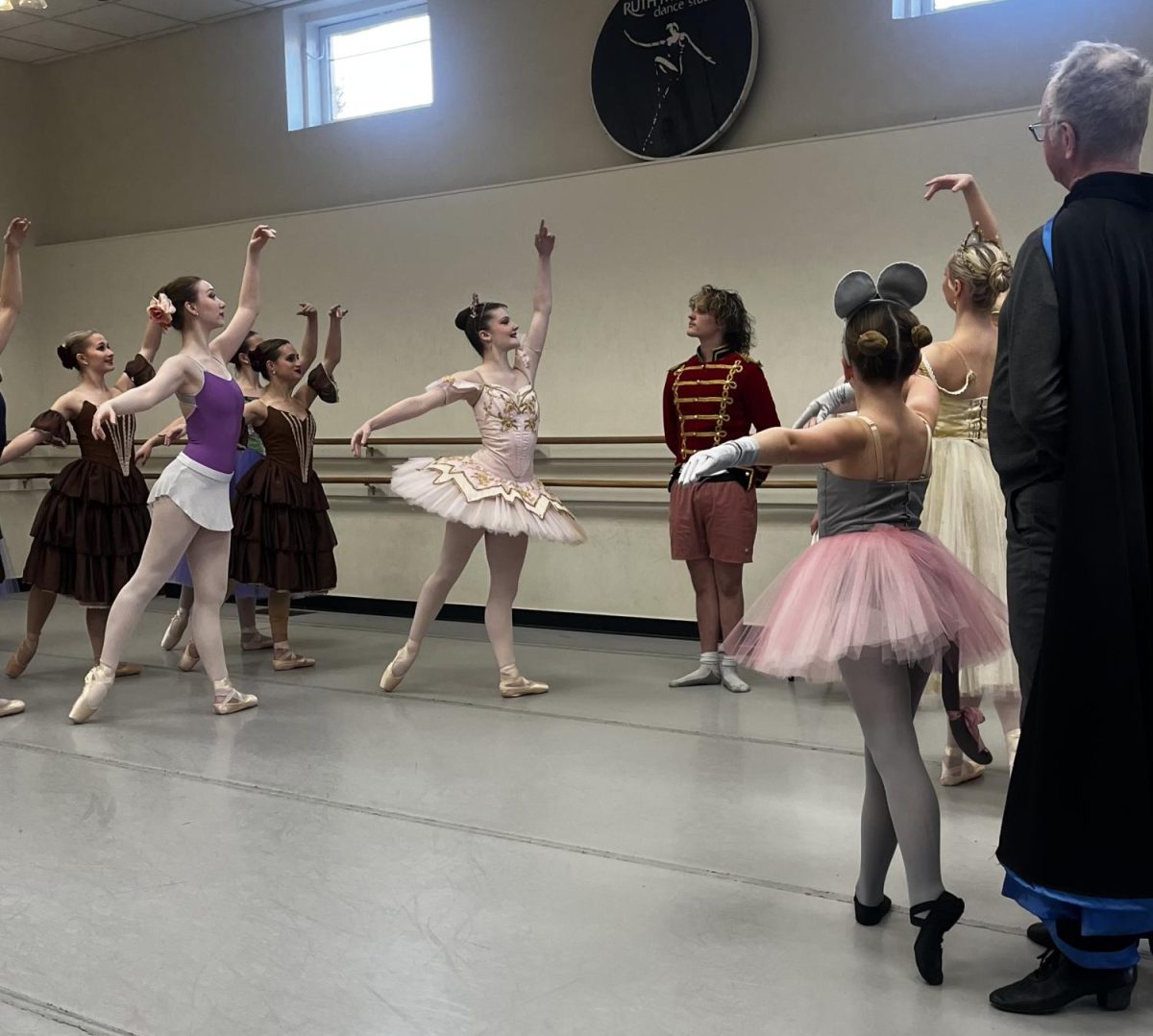 Dancers in the Land of Sweets bow to the Nutcracker prince and Clara. 

