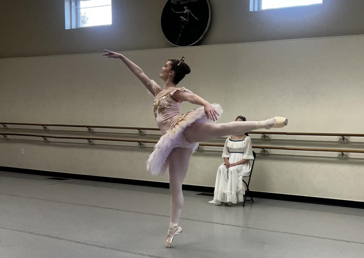 Amelia Jenkins does an arabesque en pointe during the dance of the Sugar Plum Fairy. The variation is the first of many divertissement performed for Clara after her arrival. 
