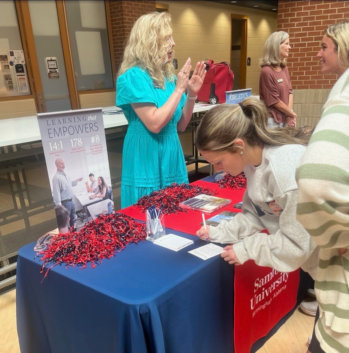 Mary Mayes Durham fills out an info card at the college fair in JHall. There will be another college fair in the spring.
