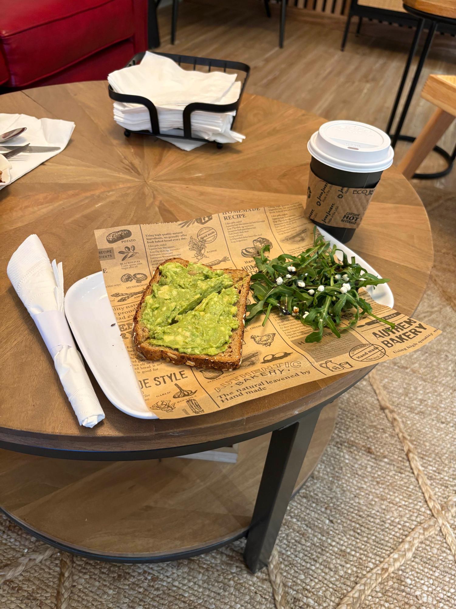 The avocado toast with a side salad along with a hot chocolate. 