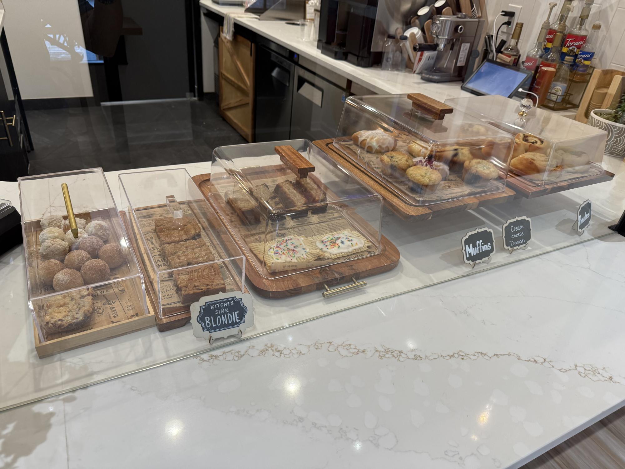 The bakery gives many options including muffins, blonde brownies, and doughnuts. 