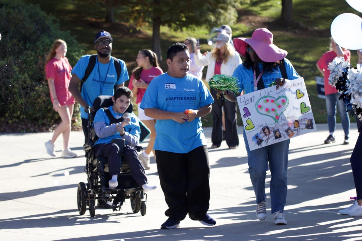 Students parade into the fifth annual Marietta Adapted Games. The inclusive event is filled with a variety of sports from races to cornhole.