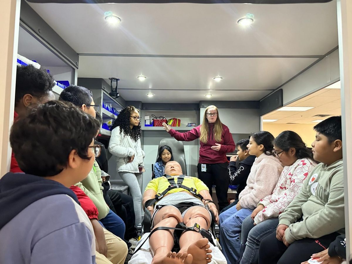 Health science teacher and athletic trainer, Ms. Ali Bird, shares information about the Emergency Medical Responder course with Hickory Hills elementary students.